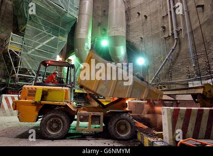 A dumper trucks fills a large spoil skip, from the boring machines tunnelling 35 metres below the streets of Whitechapel, east London, which has proved to be one of the most challenging and impressive sites in the whole Crossrail project, and will be part of the 38 station route from Maidenhead Royal Berkshire in the west to Shenfield in Essex in the east. Stock Photo