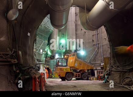 A dumper trucks fill a large spoil skip, from the boring machines tunnelling 35 metres below the streets of Whitechapel, east London, which has proved to be one of the most challenging and impressive sites in the whole Crossrail project, and will be part of the 38 station route from Maidenhead Royal Berkshire in the west to Shenfield in Essex in the east. Stock Photo