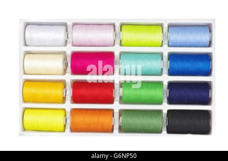 colourful threads in box on white background Stock Photo