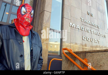 David Chick leaves Thames Magistrates Court in London. Mr Chick staged a protest dressed as Spiderman on top of a crane near London's Tower Bridge last month about the denial of fathers access rights to their children. Stock Photo