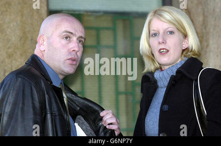 David Chick and his partner Gemma Lawrence leave Thames Magistrates Court in London. Mr Chick staged a protest dressed as Spiderman on top of a crane near London's Tower Bridge last month about the denial of fathers access rights to their children. Stock Photo