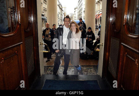 Actors Alyson Hannigan and Luke Perry pose for photographers during a photocall and press launch for their new stage adaptation of 1989's romantic comedy film When Harry Met Sally outside the Theatre Royal in London's Hatmarket. The play opens at the theatre on January 20th. Stock Photo