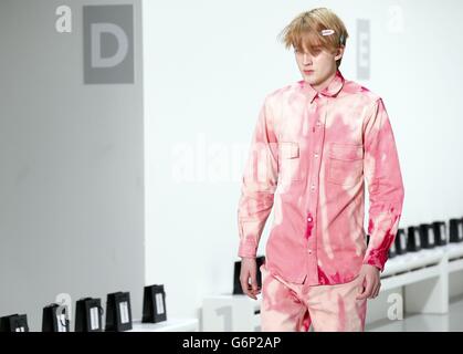 A model appears on the catwalk during a rehearsal for the Lou Dalton show at British Fashion Council's London Collections: Men fashion event, Victoria House, London. Stock Photo