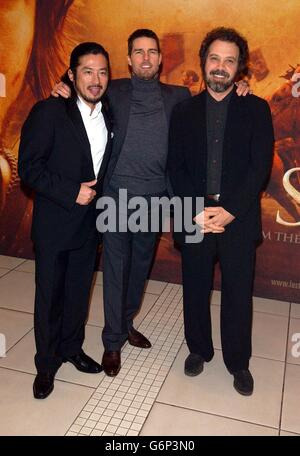 Actors Hiroyuki Sanada (L) and Tom Cruise (C) pose with their director Edward Zwick as they arrive for the UK film premiere of The Last Samurai, held at the Odeon Leicester Square, central London. Stock Photo