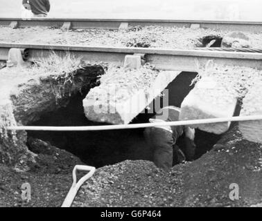 The National Coal Board claims this man risks being crushed from a landslide as he illegally digs for coal beneath the board's Hawthorn Incline Railway in County Durham. Vandalism of the railway has occurred during the eight-month miners strike, claims the Board. Stock Photo