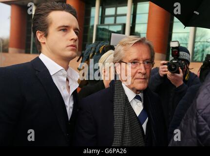 Coronation Street actor William Roache who plays Ken Barlow, arrives with his son James at Preston Crown Court where he faces two counts of raping a 15-year-old girl in east Lancashire in 1967, and five indecent assaults involving four girls aged between 11 or 12 and 16 in the Manchester area in 1965 and 1968. Stock Photo