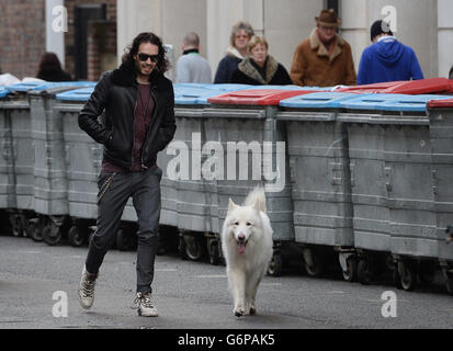 Russell Brand arrives at the London Film Museum with his dog Brian where he announced new funding for the drug and alcohol treatment recovery communities on behalf of the Give It Up Fund that he has set up. Stock Photo