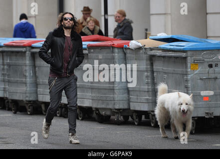 Russell Brand arrives at the London Film Museum with his dog Brian where he announced new funding for the drug and alcohol treatment recovery communities on behalf of the Give It Up Fund that he has set up. Stock Photo