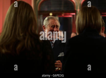 The Prince of Wales talking to guests, during a leadership reception hosted by The Prince's Trust at The Royal Courts of Justice in London. PRESS ASSOCIATION Photo. Picture date: Thursday January 23, 2014. Charles has praised the work done by football clubs to help his youth charity. The Prince's Trust Football Initiative has helped more than 22,500 disadvantaged young people since 1997. The scheme, which is delivered by 40 professional clubs, offers motivation, team-building skills and a chance to gain qualifications. It is funded by the Premier League and the Professional Footballers' Stock Photo