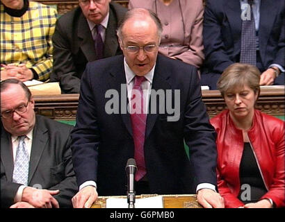 Leader of the Conservative Party, Michael Howard, questioning Prime Minister Tony Blair during his regular weekly Question Time in the House of Commons, London. Mr Howard was among MP's who challenged the Prime Minister ahead of the formal publication of the Hutton report into the circumstances surrounding the death of Government weapons expert Dr David Kelly. Stock Photo