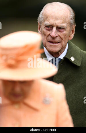 Queen Elizabeth II and the Duke of Edinburgh attend the church of St Peter, Wolferton, on the royal Sandringham estate in Norfolk. Stock Photo