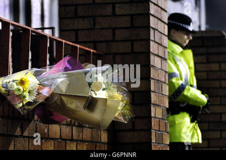 Floral tributes were laid out at the scene of a fatal fire which claimed the lives of 10 residents at a care home for the elderly. There were few visible signs of the blaze at Rosepark Nursing Home in Uddingston, near Glasgow. Stock Photo