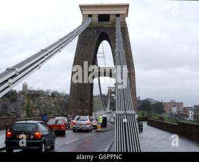 Traffic crossing again moments after the end of the protest on a tower of the Clifton Suspension Bridge, Bristol. Stock Photo