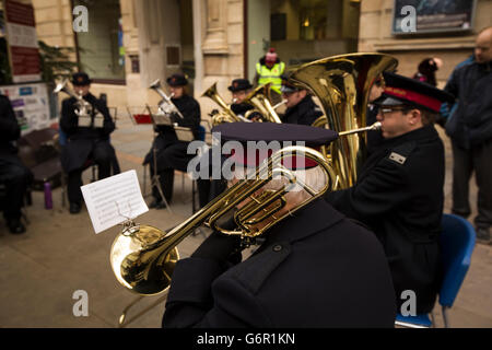 UK, Gloucestershire, Gloucester, Eastgate Street, Salvation Army band outside Guildhall at Christmas Stock Photo