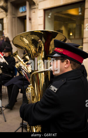 UK, Gloucestershire, Gloucester, Eastgate Street, Salvation Army band outside Guildhall at Christmas, tuba player Stock Photo