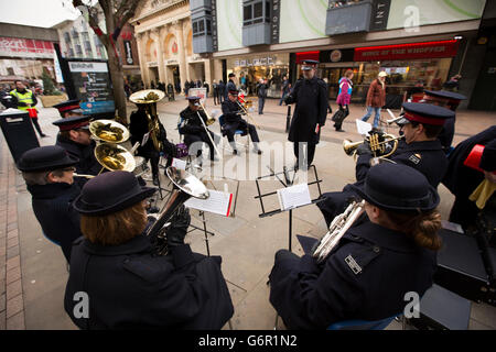 UK, Gloucestershire, Gloucester, Eastgate Street, Salvation Army band playing outside at Christmas Stock Photo