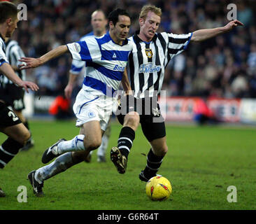 Queens Park Rangers' Matthew Rose (L) and Nptts County's Paul Bolland in action during the Nationwide Division Two match at Loftus Road, west London. NO UNOFFICIAL CLUB WEBSITE USE. Stock Photo