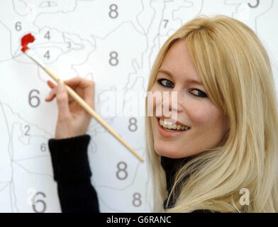 Model Claudia Schiffer launches 'Paint By Numbers' in association with Tate, at Covent Garden in central London. The public art event allows members of the public to 'paint by numbers' on four giant canvasses, which will be placed across the capital as part of 'One Amazing Week' to attract tourism in London. The painting featured is Modigliani's Portrait of a Girl. Stock Photo