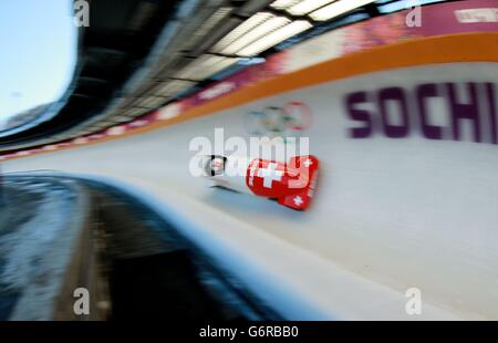 Sochi Winter Olympic Games - Pre-Games activity - Wednesday. The Womens 2-Men Bobsleigh Team from Switzerland practice at the Sanki Sliding Centre during the 2014 Sochi Olympic Games in Sochi, Russia. Stock Photo