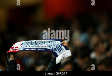 Soccer - FA Cup - Fourth Round - Arsenal v Coventry City - Emirates Stadium. A Coventry City fan shows his support with his scarf in the stands Stock Photo