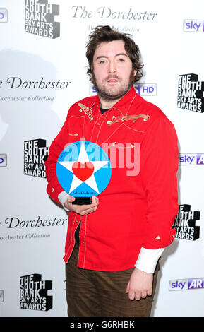 Nick Helm wins the Times Breakthrough award at the South Bank Sky Arts Awards at the Dorchester Hotel, London. Stock Photo