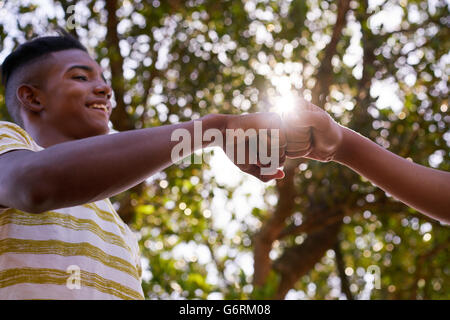 Youth culture, young multi ethnic people together. Black and white boys meeting. Concept of racism. Stock Photo