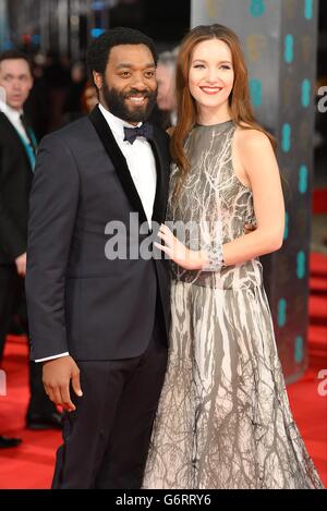Chiwetel Ejiofor and Sari Mercer The EE British Academy Film Awards 2014, at the Royal Opera House, Bow Street, London. Stock Photo