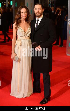 Kelly Marcel and Tom Hardy arriving at The EE British Academy Film Awards 2014, at the Royal Opera House, Bow Street, London. Stock Photo