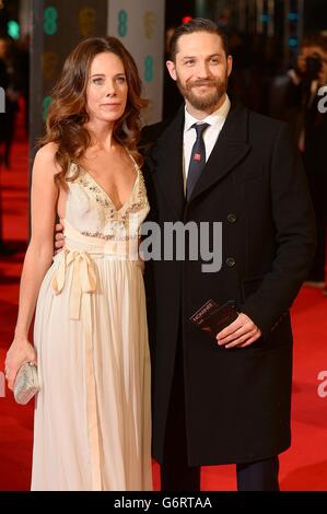 Kelly Marcel and Tom Hardy arriving at The EE British Academy Film Awards 2014, at the Royal Opera House, Bow Street, London. Stock Photo