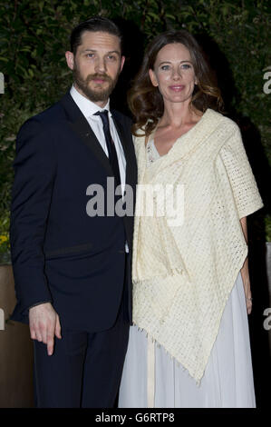 Tom Hardy and Kelly Marcel arrive at The EE British Academy Film Awards 2014 dinner held at the Grosvenor House Hotel, Central London. Stock Photo