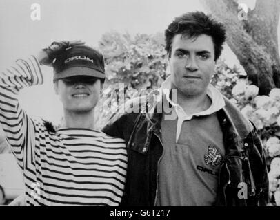 Duran Duran pop star Simon Le Bon, with his girlfriend Yasmin Parvaneh, recovering from his ordeal after being rescued from his 77ft maxi yacht, Drum, which capsized with 24 people on board off Falmouth, along the southern coast of Cornwall, while taking part in the Fastnet Race. Le Bon and other crew members were trapped underwater, inside the hull, for forty minutes and were all rescued by the Royal Navy. Stock Photo