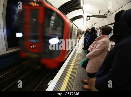 Commuters on the Victoria Line platform at King's Cross station during the London Underground workers strike over planned job cuts and ticket office closures as talks aimed at resolving the dispute will be held tomorrow, but a crippling strike will continue today. Stock Photo