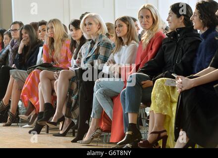 Portia Freeman (5th right), Olivia Palermo (4th right) and Poppy Delevingne (3rd right) attend the Emilia Wickstead Autumn/Winter 2014 show at The Royal Institute of British Architects, London. Stock Photo