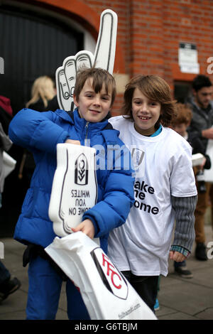 Soccer - Barclays Premier League - Fulham v Southampton - Craven Cottage. Young Fulham fans show their support outside the ground before the game Stock Photo