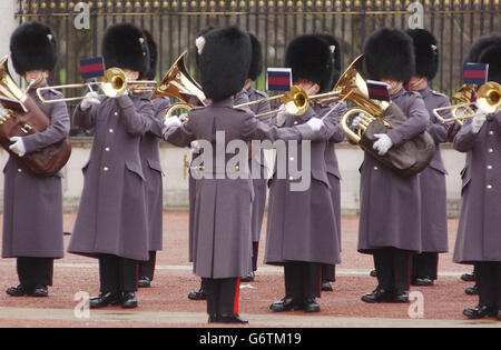 The Coldstream Guards Band play the national anthem of Spain in the forecourt at Buckingham Palace, London, during a revised Changing the Guard ceremony in memory of the people killed in the terrorist bombings in Madrid last week. Two hundred people were killed in Madrid when a series of bombs ripped through rush-hour trains on Thursday.