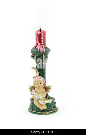 Bruning red aroma candle, with wax on cupid holder, isolated white background Stock Photo