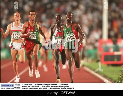 03-AUG-96. Atlanta Olympic Games. Athletics, Mens 5000m Final. Burundi's Venuste Niyongaba crosses the line to win gold Stock Photo