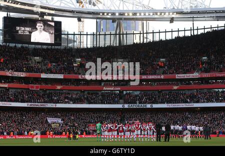 General view of the two team's as they observe a minute's silence in remembrance of former Preston North End and England footballer Sir Tom Finney Stock Photo