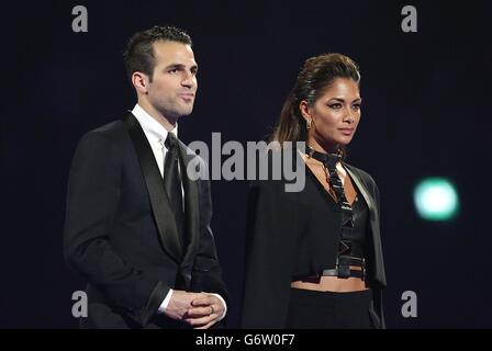 Brit Awards 2014 - Show - London. Cesc Fabregas and Nicole Scherzinger during the 2014 Brit Awards at the O2 Arena, London. Stock Photo