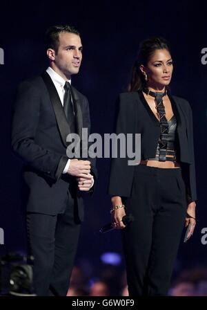 Brit Awards 2014 - Show - London. Cesc Fabregas and Nicole Scherzinger during the 2014 Brit Awards at the O2 Arena, London. Stock Photo