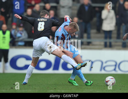 Northampton Town's Ian Morris (left) and Scunthorpe United's Paddy Madden battle for the ball during the Sky Bet League Two match at Glanford Park, Scunthorpe. PRESS ASSOCIATION Photo. Picture date: Saturday March 8, 2014. See PA story SOCCER Scunthorpe. Photo credit should read: Dave Howarth/PA Wire. Stock Photo