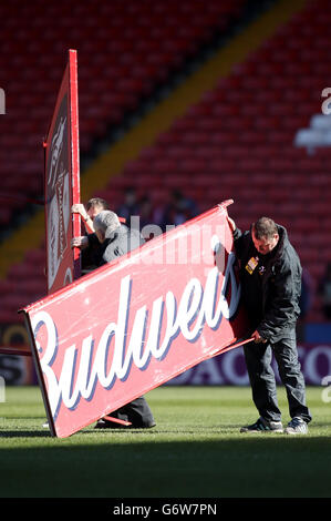 Soccer - FA Cup - Sixth Round - Sheffield United v Charlton Athletic - Bramall Lane. Ground staff prepare Budweiser advertising boards on the pitch before the game Stock Photo