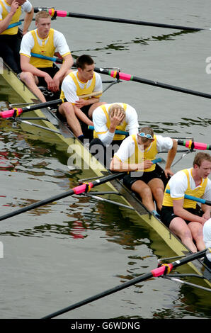 The Goldie team from Cambridge look dejected after losing their race against Isis from Oxford on the River Thames in south-west London. The Goldie v Isis race is the reserve race which is held prior to the boat race. Stock Photo