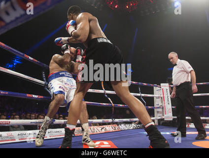 Anthony Joshua (right) in action against Hector Avila during their Heavyweight bout at the SECC, Glasgow. Stock Photo