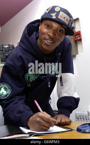 So Solid Crew member Asher D poses for photographers during a book signing to promote his autobiography 'So Solid', at Newham Bookshop in east London. Stock Photo