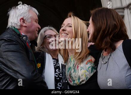 Beth Warren leaves the Law Courts in London with her mother Georgina Hyde (far right), and her in-laws, Kevin and Helen Brewer, after she won her High Court fight to preserve her late husband's sperm. Stock Photo