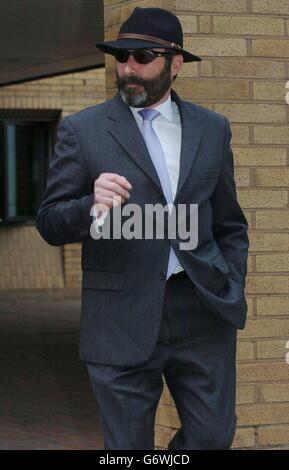 The husband of former secretary at Goldman Sachs Joyti De-Laurey, Anthony, leaves Southwark Crown Court in London, where his wife is facing charges of the alleged theft of 4.4 million from her three bosses. Mr De-Laurey, a 50-year-old former chauffeur and Mrs De-Laurey's mother, Dr Devi Schahhou, a 68-year-old GP of King Henry's Road, Hampstead, north-west London both deny money laundering charges. Stock Photo