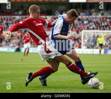 Millwall's Neil Harris (right) holds off Michael Dawson of Nottingham Forest, during their Nationwide Division One match at The City Ground, Nottingham, Saturday 17th April 2004. Stock Photo