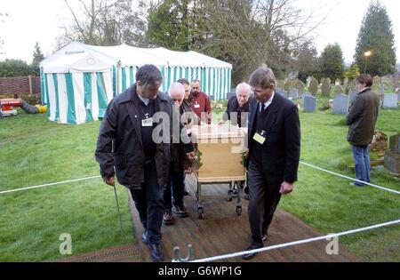 Rachel Whitear's coffin is led to a hearse, after it was exhumed at the Church of St Peter in Withington, near Hereford. It was originally thought that Miss Whitear died from a drugs overdose at her bedsit in Exmouth, Devon, but no post-mortem examination was carried out prior to an inquest which recorded an open verdict. Stock Photo