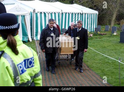 Rachel Whitear's coffin is led to a hearse, after it was exhumed at the Church of St Peter in Withington, near Hereford. It was originally thought that Miss Whitear died from a drugs overdose at her bedsit in Exmouth, Devon, but no post-mortem examination was carried out prior to an inquest which recorded an open verdict. Stock Photo